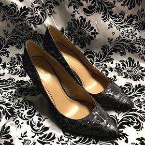 Black lace high heel pumps